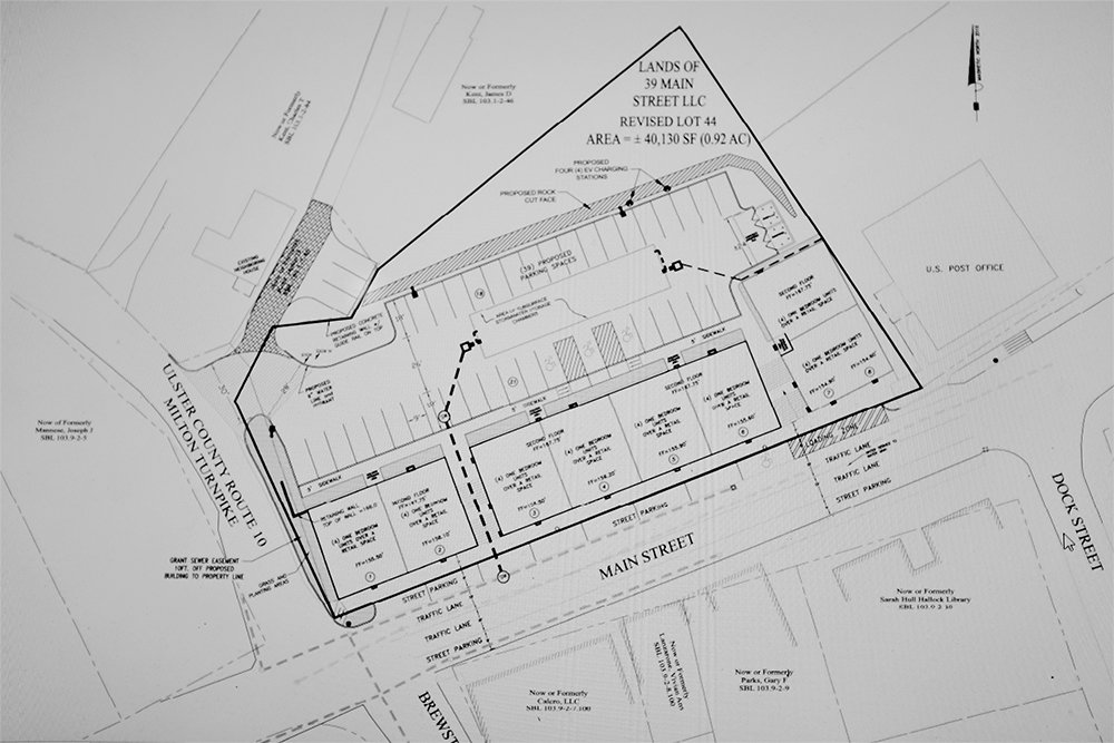 A close up of proposed plans aimed at revitalizing the hamlet of Milton, showing 8 retail stores with 32 apartments fronting Main Street and parking in the rear.